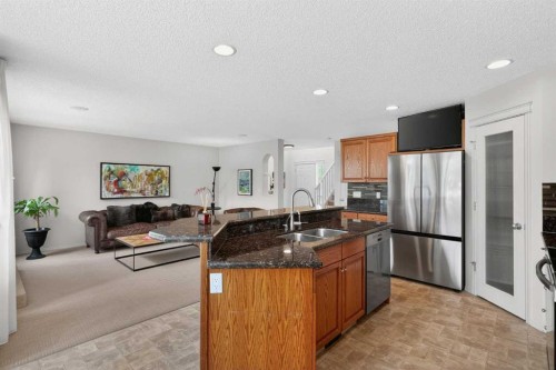 98 Cougarstone Close Sw, Calgary, AB - Indoor Photo Showing Kitchen With Stainless Steel Kitchen With Double Sink