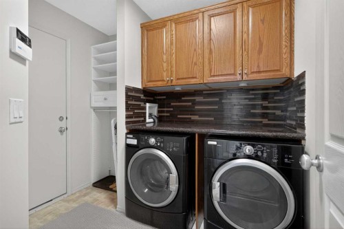98 Cougarstone Close Sw, Calgary, AB - Indoor Photo Showing Laundry Room