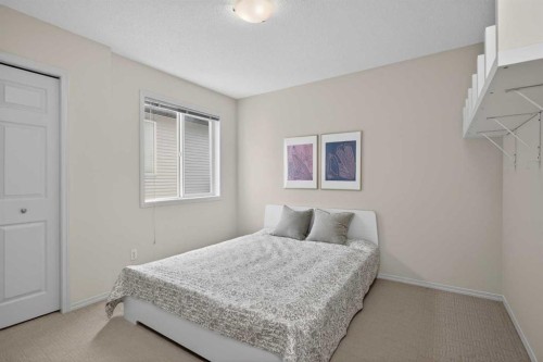 98 Cougarstone Close Sw, Calgary, AB - Indoor Photo Showing Bedroom