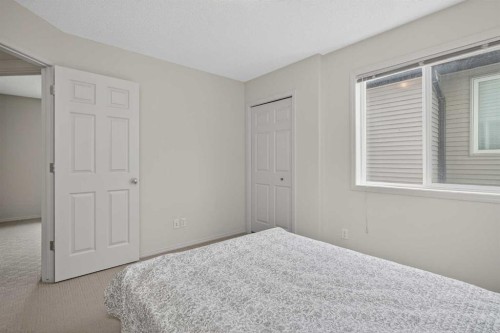 98 Cougarstone Close Sw, Calgary, AB - Indoor Photo Showing Bedroom