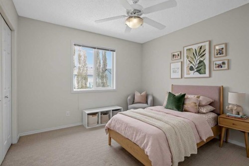 98 Cougarstone Close Sw, Calgary, AB - Indoor Photo Showing Bedroom