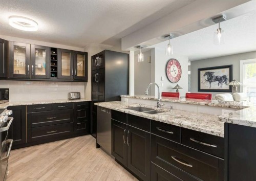 84 Fullerton Road Se, Calgary, AB - Indoor Photo Showing Kitchen With Double Sink
