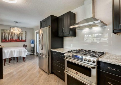84 Fullerton Road Se, Calgary, AB - Indoor Photo Showing Kitchen With Stainless Steel Kitchen With Upgraded Kitchen