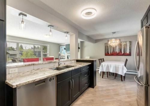 84 Fullerton Road Se, Calgary, AB - Indoor Photo Showing Kitchen With Double Sink