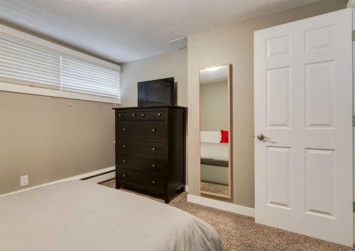 84 Fullerton Road Se, Calgary, AB - Indoor Photo Showing Bedroom