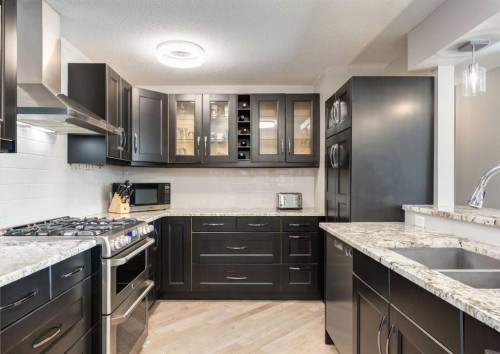 84 Fullerton Road Se, Calgary, AB - Indoor Photo Showing Kitchen With Double Sink With Upgraded Kitchen