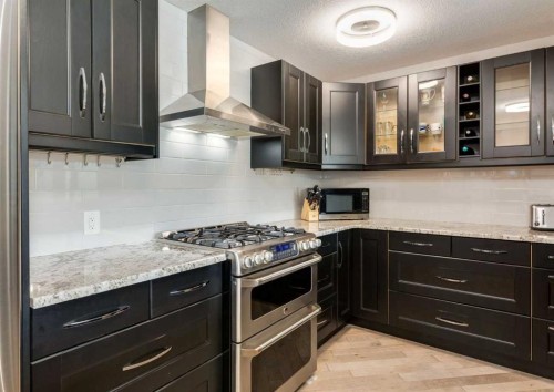 84 Fullerton Road Se, Calgary, AB - Indoor Photo Showing Kitchen With Stainless Steel Kitchen With Upgraded Kitchen