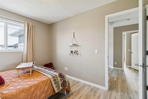416 Stonegate Road Nw, Airdrie, AB - Indoor Photo Showing Bedroom
