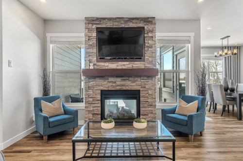 1205 Hillcrest Manor Estates, Strathmore, AB - Indoor Photo Showing Living Room With Fireplace