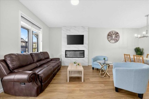 10 Lucas Close Nw, Calgary, AB - Indoor Photo Showing Living Room With Fireplace