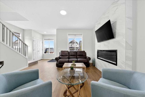 10 Lucas Close Nw, Calgary, AB - Indoor Photo Showing Living Room With Fireplace
