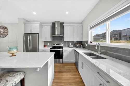 10 Lucas Close Nw, Calgary, AB - Indoor Photo Showing Kitchen With Stainless Steel Kitchen With Double Sink With Upgraded Kitchen