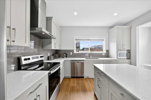 10 Lucas Close Nw, Calgary, AB - Indoor Photo Showing Kitchen With Stainless Steel Kitchen With Upgraded Kitchen