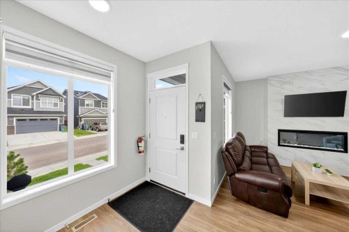 10 Lucas Close Nw, Calgary, AB - Indoor With Fireplace