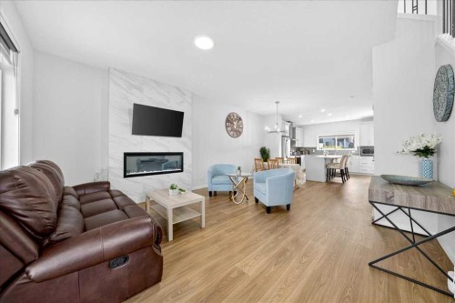 10 Lucas Close Nw, Calgary, AB - Indoor Photo Showing Living Room With Fireplace