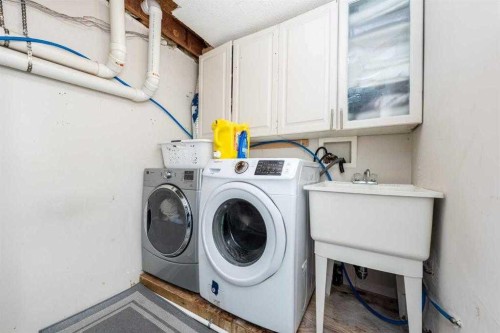 23 Falsby Place Ne, Calgary, AB - Indoor Photo Showing Laundry Room