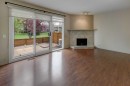 82 Point Drive Nw, Calgary, AB  - Indoor Photo Showing Living Room With Fireplace 