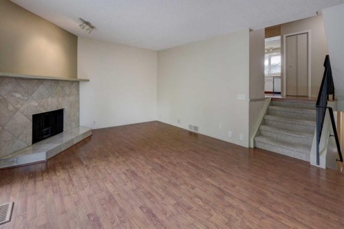 82 Point Drive Nw, Calgary, AB - Indoor With Fireplace