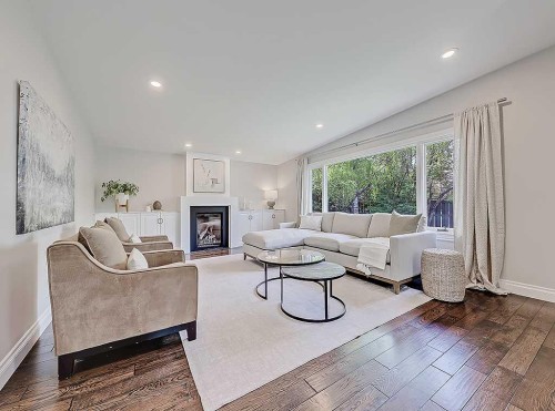 907 Kerfoot Crescent Sw, Calgary, AB - Indoor Photo Showing Living Room With Fireplace