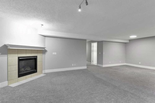 197 Royal Crest View Nw, Calgary, AB - Indoor With Fireplace