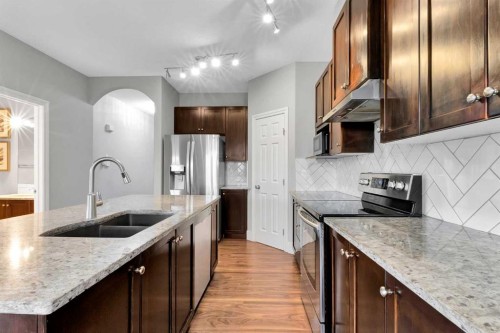 197 Royal Crest View Nw, Calgary, AB - Indoor Photo Showing Kitchen With Double Sink With Upgraded Kitchen