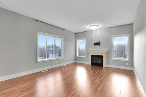 197 Royal Crest View Nw, Calgary, AB - Indoor Photo Showing Living Room With Fireplace
