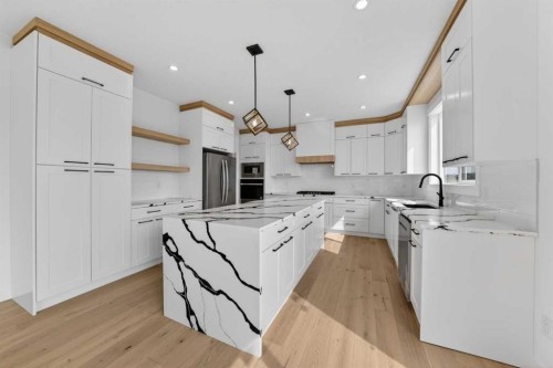 8 Ranchers Meadows, Okotoks, AB - Indoor Photo Showing Kitchen With Upgraded Kitchen