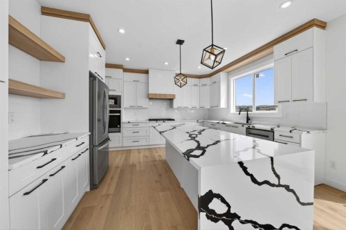 8 Ranchers Meadows, Okotoks, AB - Indoor Photo Showing Kitchen With Upgraded Kitchen