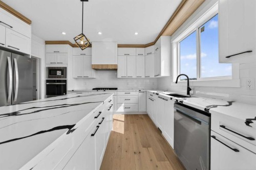 8 Ranchers Meadows, Okotoks, AB - Indoor Photo Showing Kitchen With Upgraded Kitchen