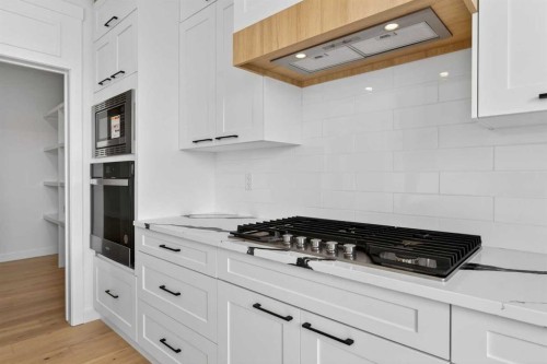 8 Ranchers Meadows, Okotoks, AB - Indoor Photo Showing Kitchen With Upgraded Kitchen