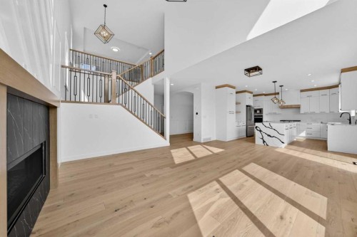 8 Ranchers Meadows, Okotoks, AB - Indoor Photo Showing Other Room With Fireplace