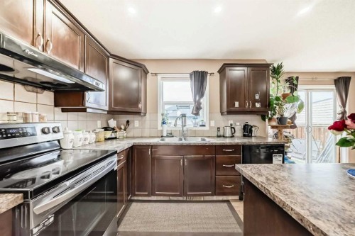 1066 Taradale Drive Ne, Calgary, AB - Indoor Photo Showing Kitchen With Double Sink
