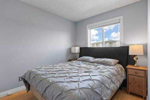 202 Willowbrook Close Nw, Airdrie, AB - Indoor Photo Showing Bedroom