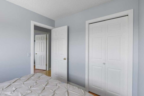 202 Willowbrook Close Nw, Airdrie, AB - Indoor Photo Showing Bedroom