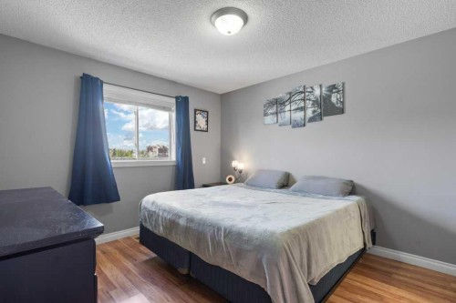 202 Willowbrook Close Nw, Airdrie, AB - Indoor Photo Showing Bedroom