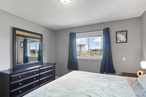 202 Willowbrook Close Nw, Airdrie, AB - Indoor Photo Showing Bedroom