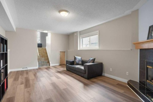 202 Willowbrook Close Nw, Airdrie, AB - Indoor With Fireplace