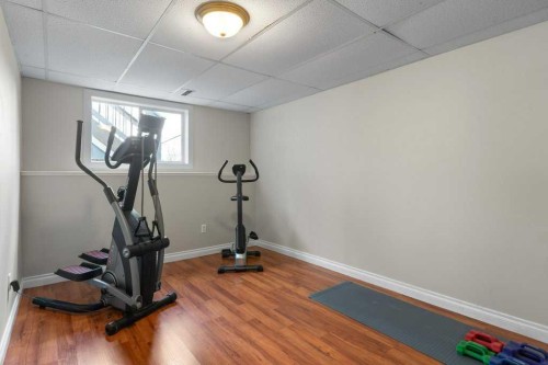 202 Willowbrook Close Nw, Airdrie, AB - Indoor Photo Showing Gym Room