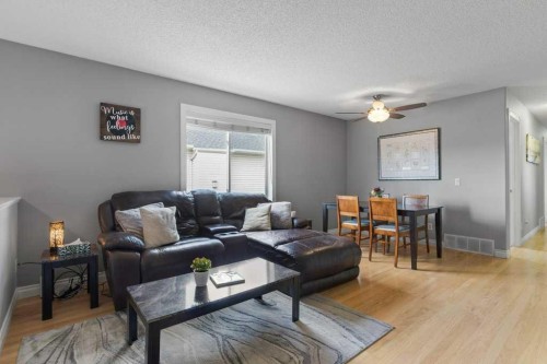 202 Willowbrook Close Nw, Airdrie, AB - Indoor Photo Showing Living Room