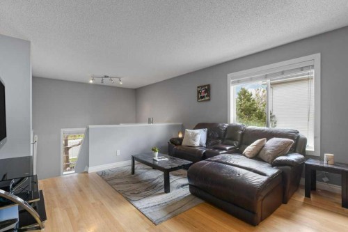 202 Willowbrook Close Nw, Airdrie, AB - Indoor Photo Showing Living Room