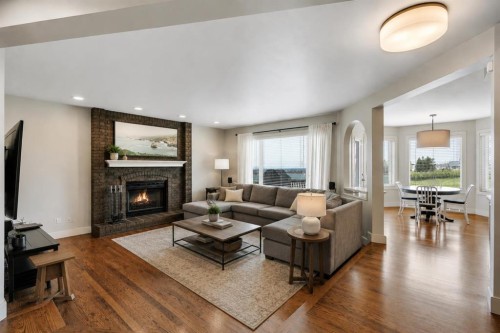 19 Coach Gate Way Sw, Calgary, AB - Indoor Photo Showing Living Room With Fireplace