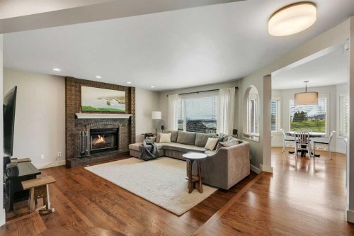 19 Coach Gate Way Sw, Calgary, AB - Indoor Photo Showing Living Room With Fireplace