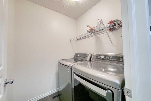 106 Sage Meadows Way Nw, Calgary, AB - Indoor Photo Showing Laundry Room