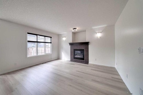 106 Sage Meadows Way Nw, Calgary, AB - Indoor Photo Showing Living Room With Fireplace