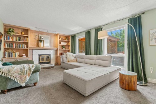 43 Westridge Drive, Okotoks, AB - Indoor Photo Showing Living Room With Fireplace