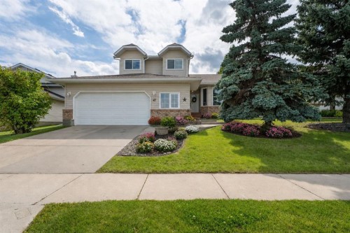 43 Westridge Drive, Okotoks, AB - Outdoor With Facade