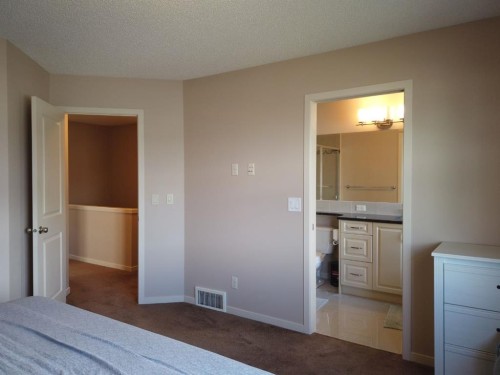 2064 New Brighton Grove Se, Calgary, AB - Indoor Photo Showing Bedroom