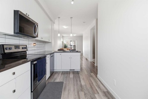 402-11 Evanscrest Mews Nw, Calgary, AB - Indoor Photo Showing Kitchen With Stainless Steel Kitchen With Upgraded Kitchen