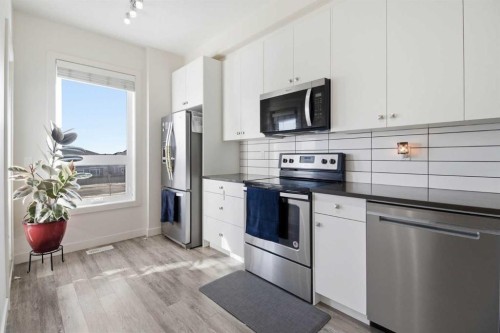 402-11 Evanscrest Mews Nw, Calgary, AB - Indoor Photo Showing Kitchen With Stainless Steel Kitchen With Upgraded Kitchen