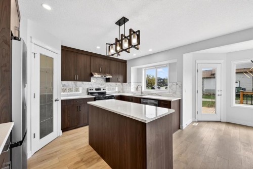 240 Cove Drive, Chestermere, AB - Indoor Photo Showing Kitchen With Upgraded Kitchen